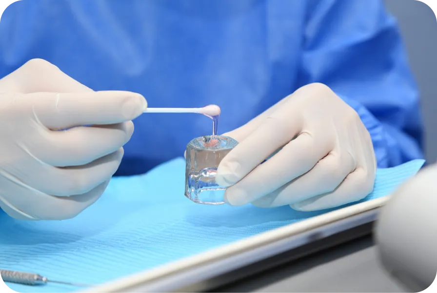 Fluoride gel being used in a modern dental clinic for fluoride treatment service.