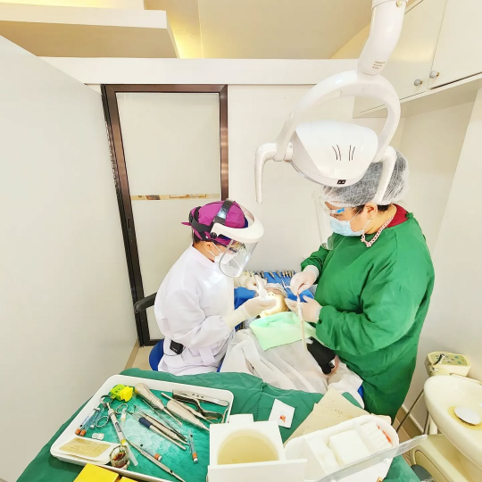 Dr. KC and her assistant are providing braces/retainer services at a dental clinic located in Makati City.