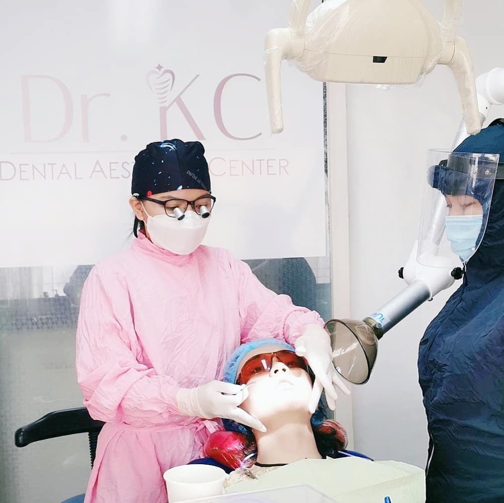 A dentist carefully performing a tooth extraction, highlighting the procedure's benefits for pain relief and improved oral health.