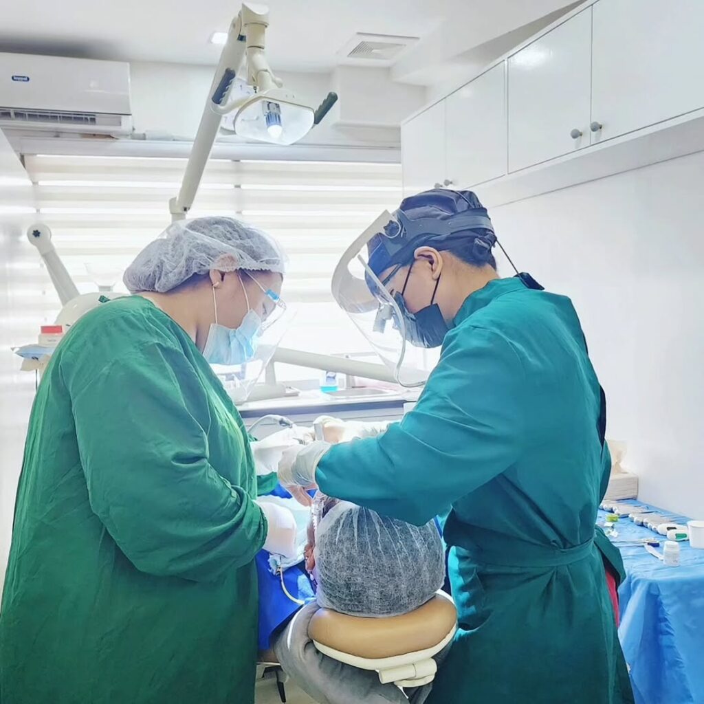Dr. KC and her assistant are providing dental implants procedure at a dental clinic located in Makati City.