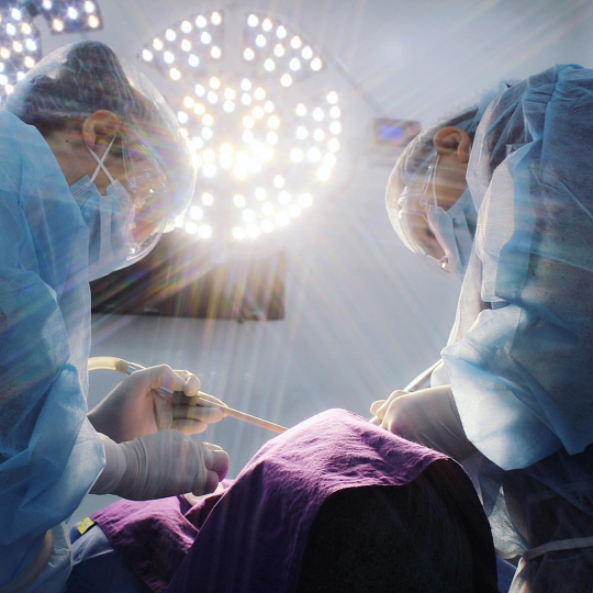 Dentist performing a thorough dental cleaning and examination.